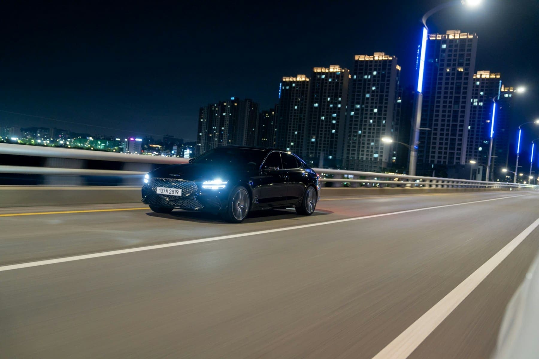 Car driving through Dubai at night